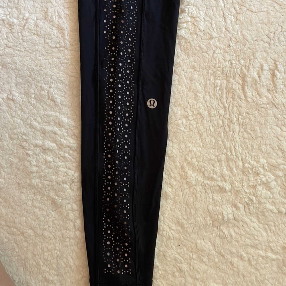 Lululemon black pants with white perforated side panel